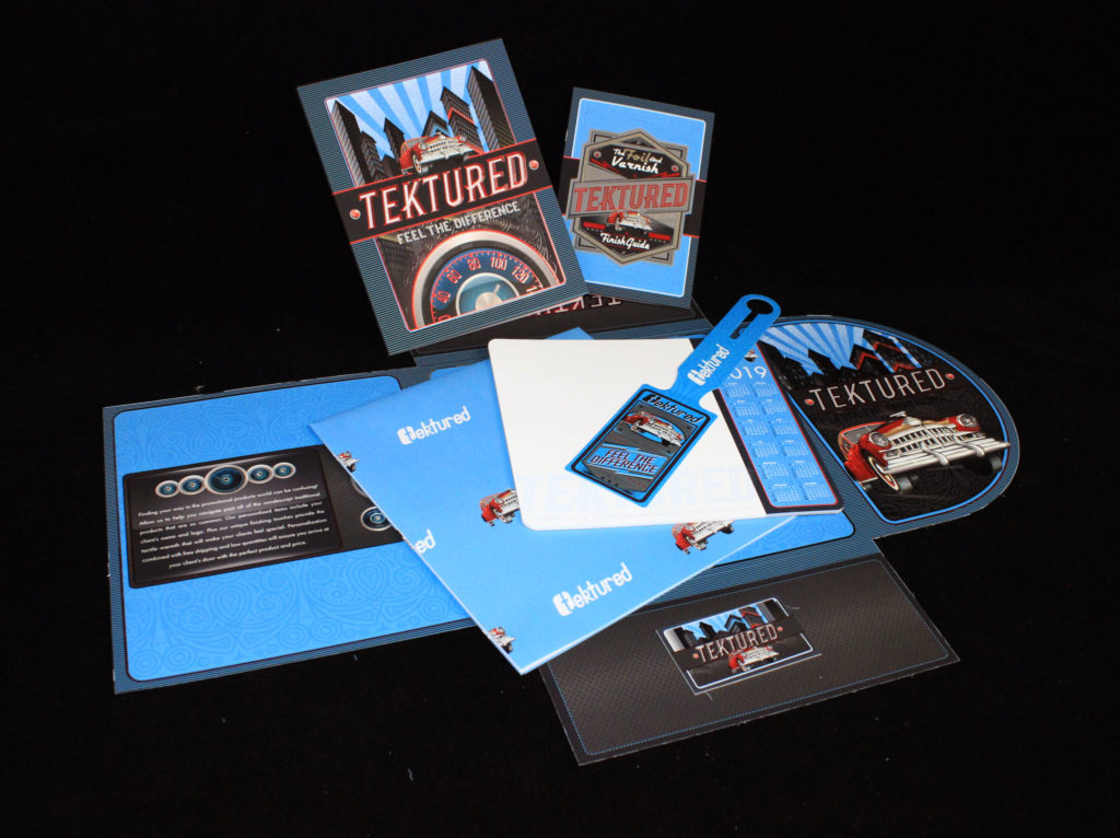A full display of the Tektured sample kit that features all the artwork and samples. The kit received three major print awards from the PPI Association.